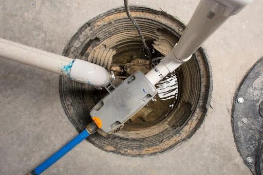 An overhead view of a residential sump pump in Springfield, MO that was just repaired by a professional plumber from Air Services.