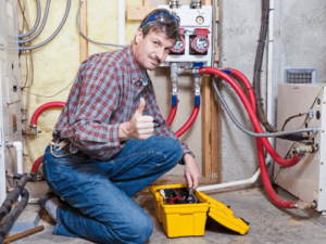 An HVAC technician providing a tune-up service for a residential furnace in Springfield, MO.